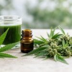 Fresh hemp leaves, hemp flower, green hemp juice, and amber raw hemp extract